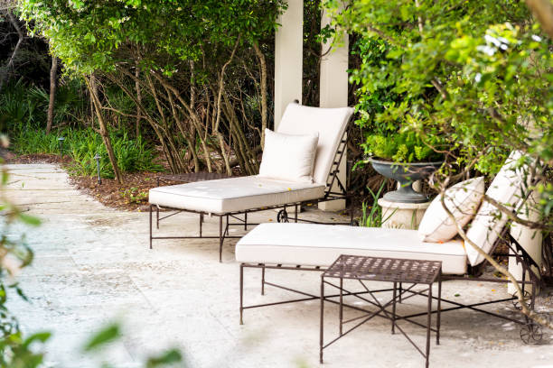 Patio two lounge chairs in outdoor spring green garden in backyard porch of home zen, plants, reclining furniture, nobody in Florida tropical Patio two lounge chairs in outdoor spring green garden in backyard porch of home zen, plants, reclining furniture, nobody in Florida tropical chaise longue photos stock pictures, royalty-free photos & images