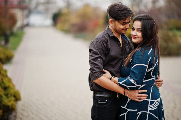 Love story of indian couple posed outdoor. Love story of indian couple posed outdoor. south indian lady stock pictures, royalty-free photos & images