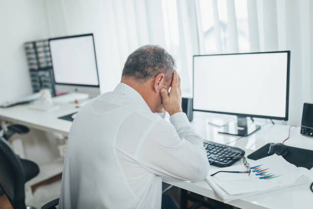 istock Worried man sitting at the office 1089135366