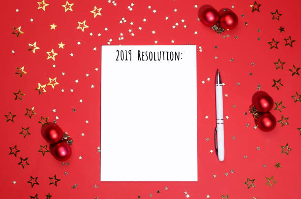 istock Notebook and pen on background of star-shaped confetti. 1089137086