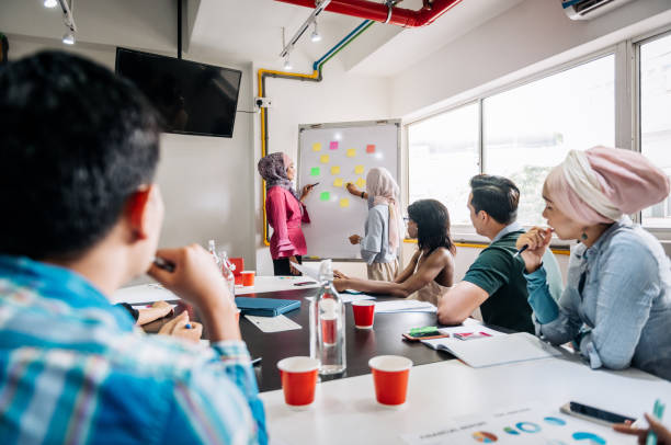 istock Adult education in Asia - solving problems with seminar participants 1089139238