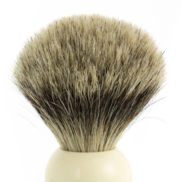 Close look at classic hand-made pure badger shaving brush on white background