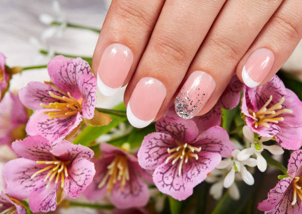 istock Hand with artificial french manicured nails 1089143838
