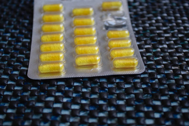 istock Different colorful pills on black background 1089144156