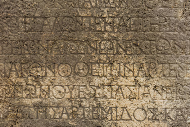 istock Real ancient letters cutted in stony wall of ancient architecture found during excavations 1089147760