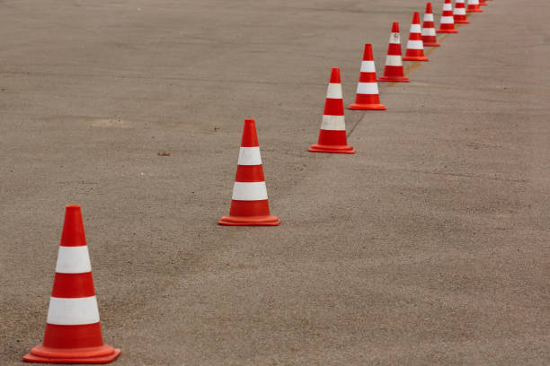 istock orange cones set up to direct traffic 1089148430
