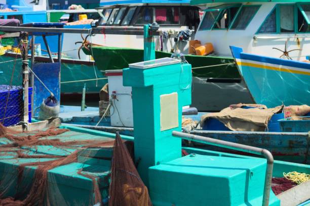 A lot of colored boats in the harbor of Male fish market (Maldives, Asia) A lot of colored boats in the harbor of Male fish market (Maldives, Asia) maldives fish market photos stock pictures, royalty-free photos & images