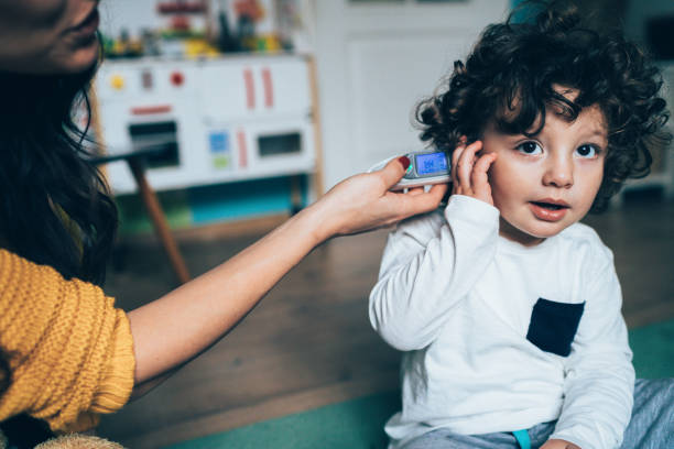 istock Measuring little boy's temperature 1089150638