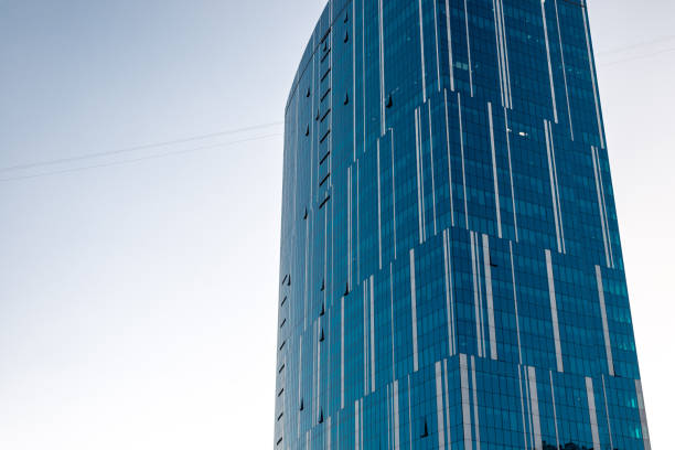 istock multi-storey glass house against the blue sky 1089152220