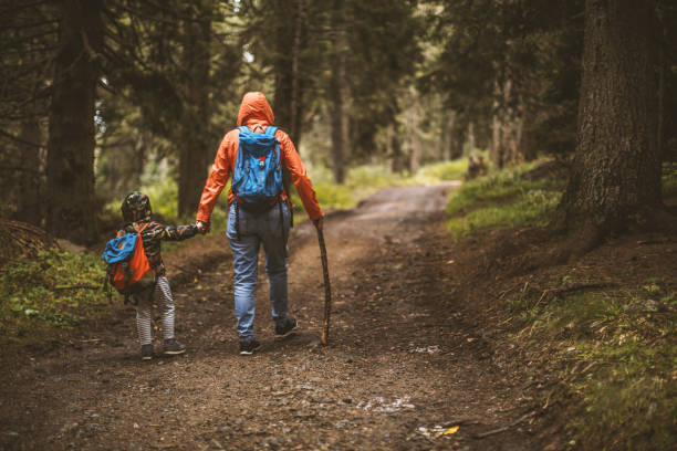 istock Mother and son hiking in forest 1089156966