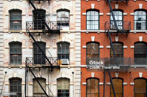 Closeup View Of New York City Style Apartment Buildings With Emergency Stairs Along Mott Street In Chinatown Neighborhood Of Manhattan New York United States Stock Photo - Download Image Now