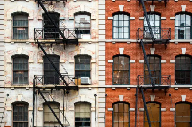 Photo of Close-up view of New York City style apartment buildings with emergency stairs along Mott Street in Chinatown neighborhood of Manhattan, New York, United States..