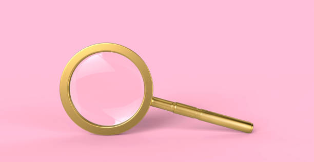 istock Golden magnifying glass isolated on minimal pink background 1089165272