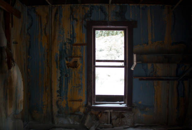 istock Looking out the Window of an Abandoned Cabin 1089165310