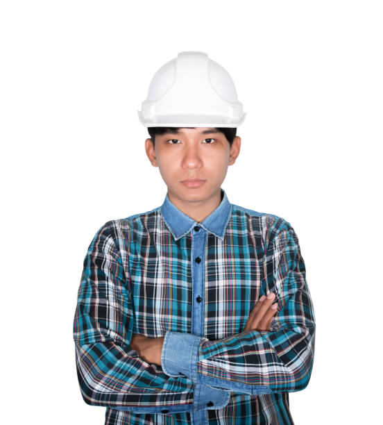 istock Engineer construction arm cross on chest and head wear white safety helmet plastic. on white background 1089167308