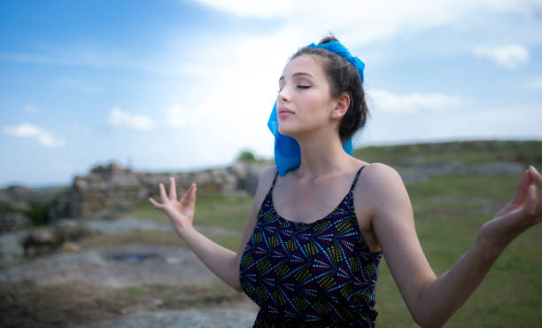 istock woman meditating in nature 1089171992