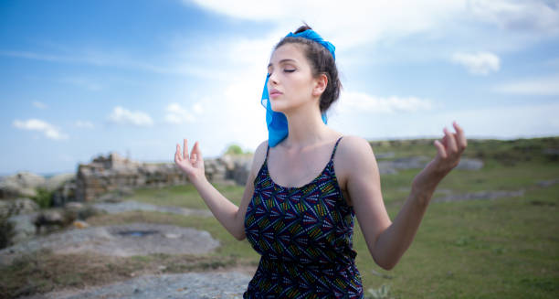 istock woman meditating in nature 1089171998