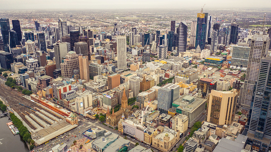 Panorama of Melbourne's city centre from a high point. Australia. Beautiful panorama of skyscrapers in the city center and suburbs to the horizon. Sunset and blue clouds.