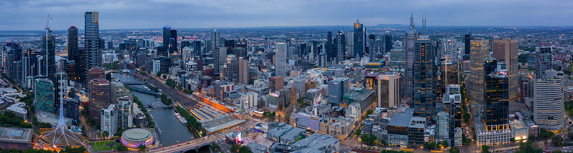 Panorama of Melbourne's city centre from a high point. Australia. Beautiful panorama of skyscrapers in the city center and suburbs to the horizon. Sunset and blue clouds.