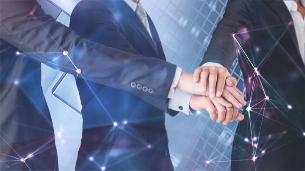 istock businessmen stack hands together in concept of business network unity 1089183304
