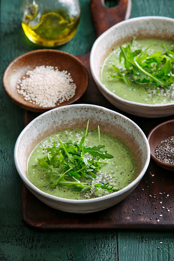 Vegetarian creamy spinach soup with chia seed and arugula