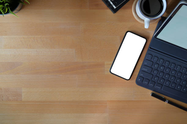 istock Top view workspace office supplies. blank screen mobile phone and copy space 1089192002