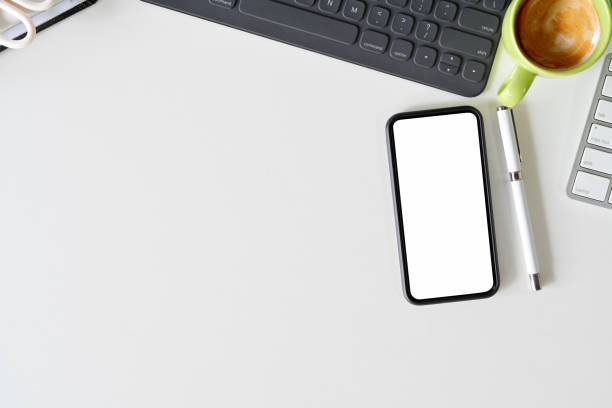 istock Top view workspace office supplies. blank screen mobile phone and copy space 1089192030