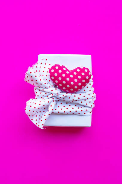 istock Valentine's heart with gift box  on pink background 1089199214
