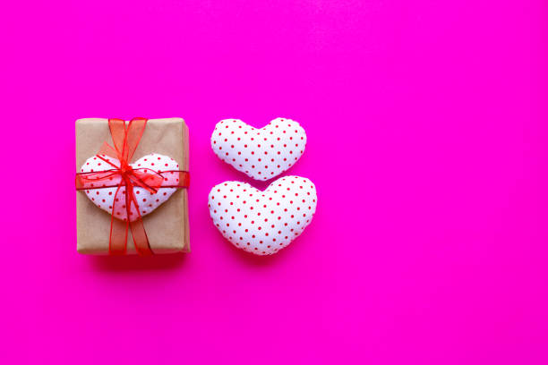 istock Valentine's heart with gift box  on pink background. 1089200634