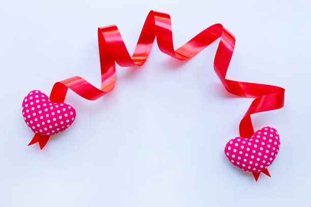 istock Valentine's hearts with ribbon on white 1089200644