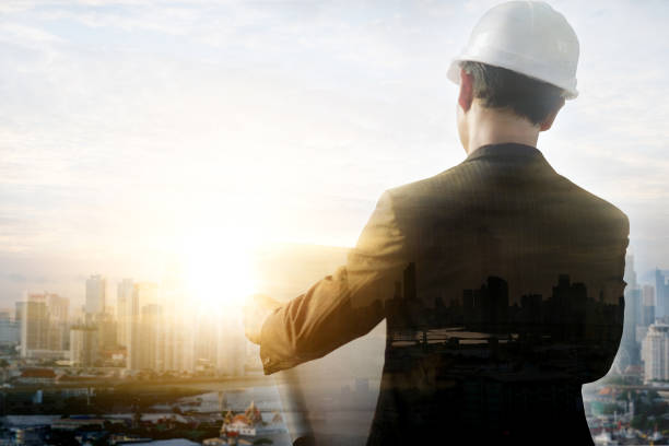 istock double exposure image of an engineer people is working and controlling the construction he looking reading a plan production 1089200672