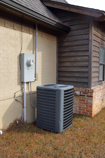 istock Air conditioner unit next to home 1089208872