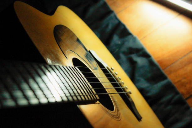 istock Guitar in dark room 1089211148