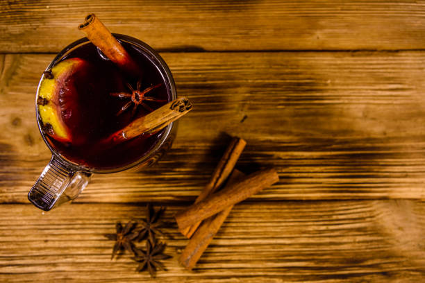 istock Cup of mulled wine with cinnamon on wooden table. Top view 1089214036
