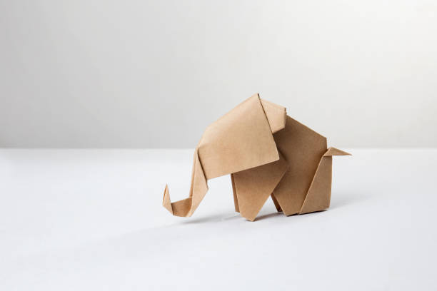istock Brown paper origami elephant isolated on white background 1089215984