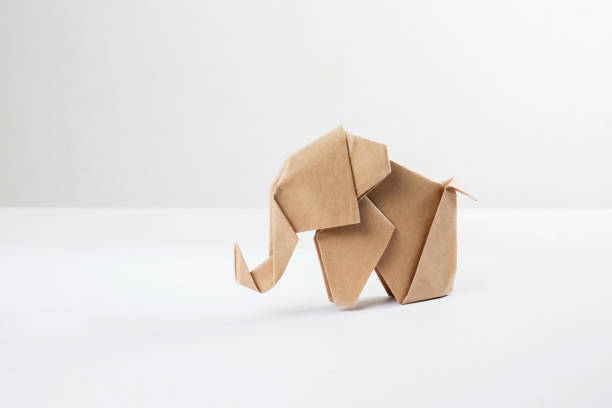 istock Brown paper origami elephant isolated on white background 1089215990
