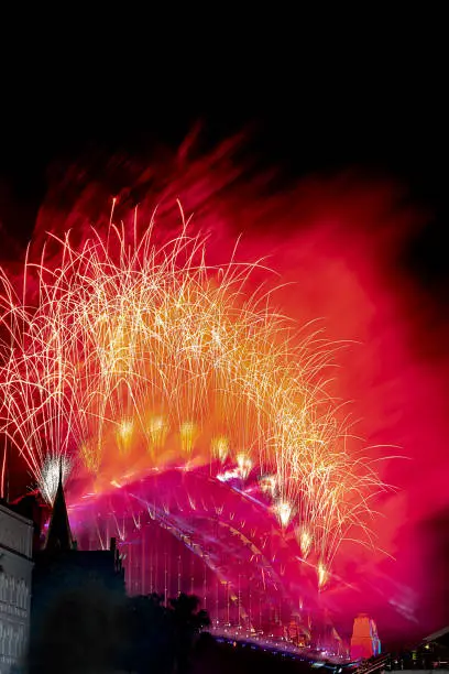 Sydney, NSW/Australia - 01 01 2019: Sydney Harbour Bridge Fireworks - Colourful flares off the bridge