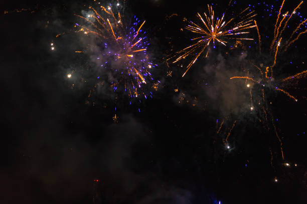 istock Amazing orange and blue fireworks on dark sky 1089234044