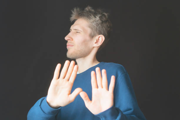 istock handsome male refuse things expressing emotions and want to stop something b 1089262078