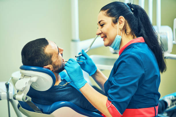 istock Dentist at work on a patient in clinic 1089262282