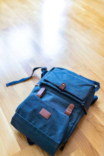 istock Retro style backpack on the parquet floor 1089264834
