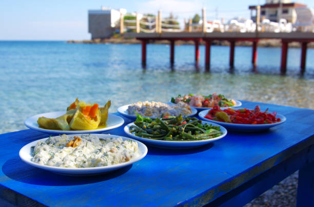 Photo shows Aegean appetizers placed on a table on the beach