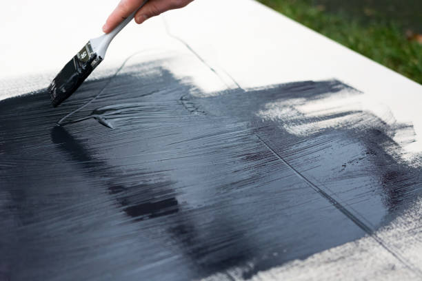 istock painting a wooden board 1089275074