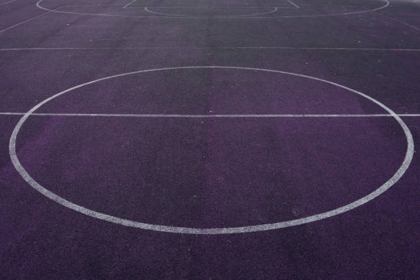 istock ball on grass processed with violet color tone . 1089279314
