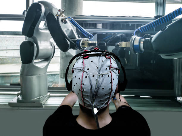 futuro della fabbrica con robotica controllata dal cervello - biofeedback foto e immagini stock
