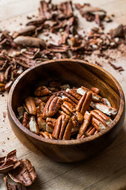 istock Peeled Pecan Nuts in Wooden Bowl without Shell / Walnuts. 1089291848