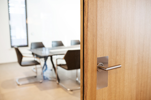 Germany: View into a meeting room behind a locked door.