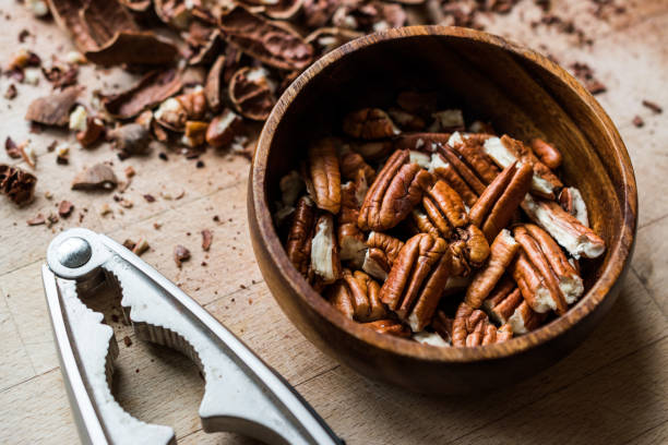 istock Peeled Pecan Nuts in Wooden Bowl without Shell / Walnuts. 1089292240
