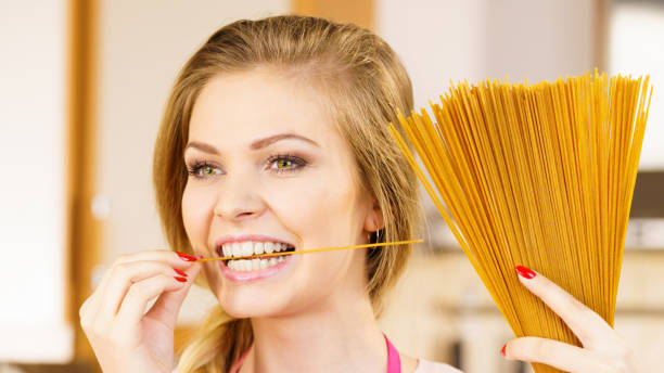 istock Woman holding long pasta 1089294524