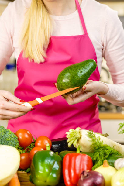 istock Woman cutting avocado 1089294760